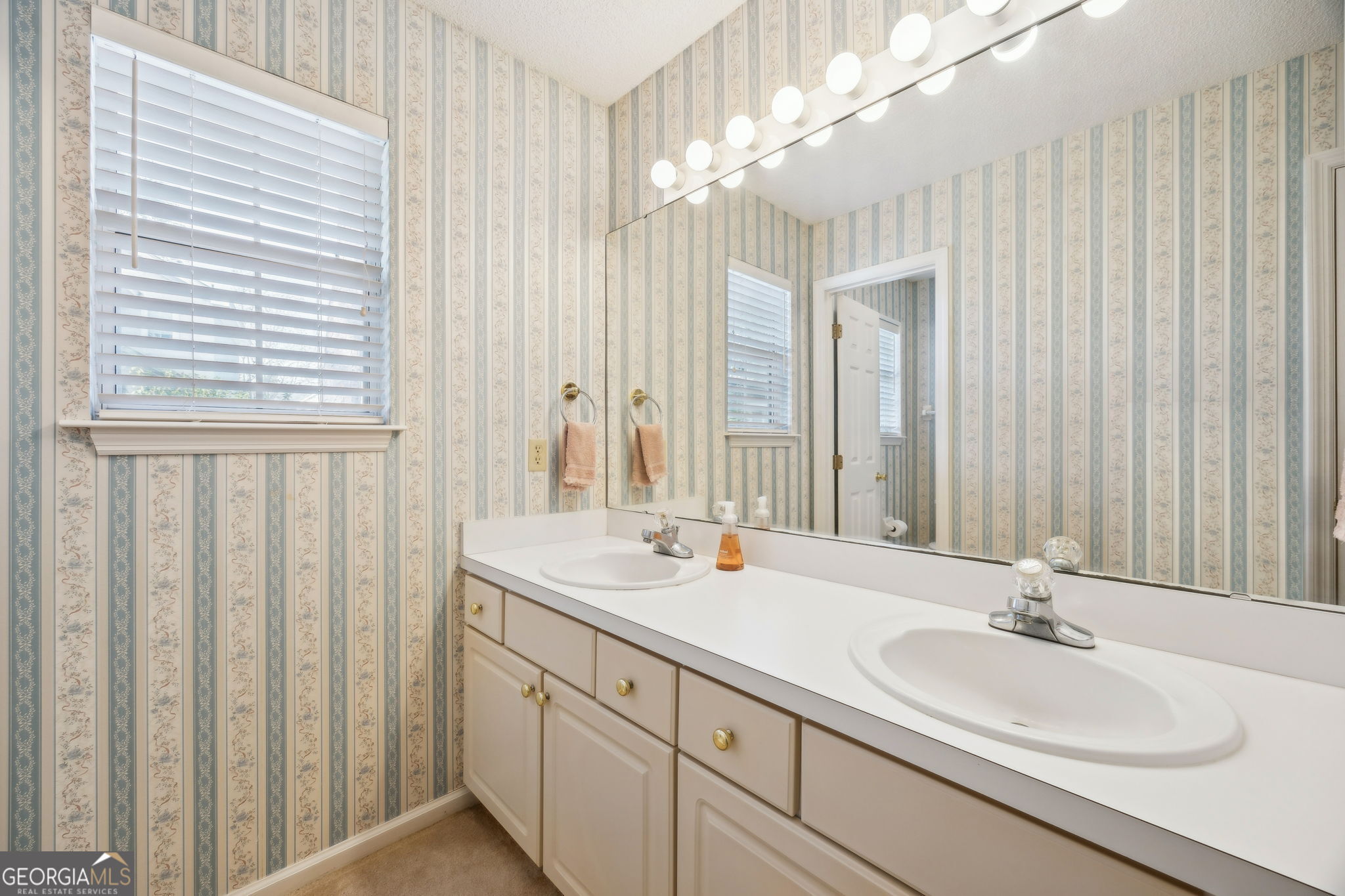 223 Cardinal Circle West St. Marys, GA 31558 - Photo 23 of 54 a bathroom with double vanity sinks and a mirror