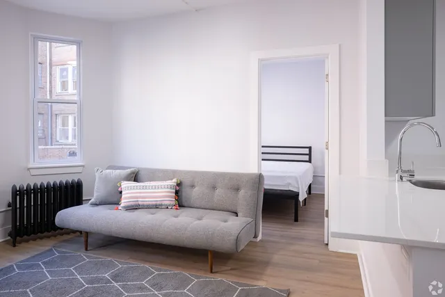 a living room with furniture and a window