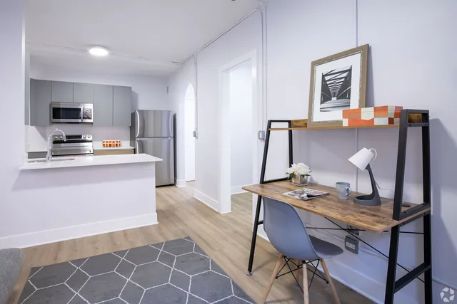 a room with furniture a flat screen tv and a table