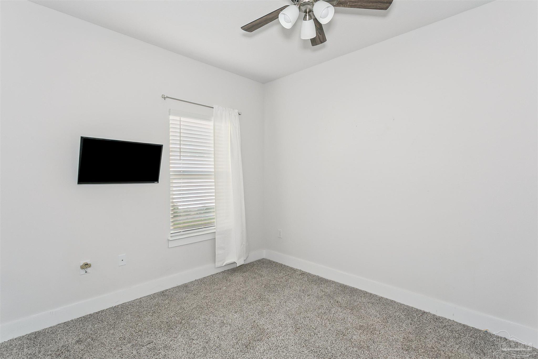 6580 Forest Bay Avenue Gulf Breeze, FL 32563 - Photo 17 of 29 a view of empty room with ceiling fan