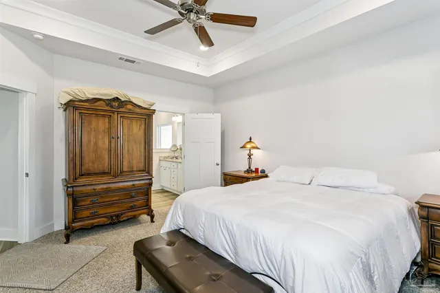 a bedroom with a bed and cabinets