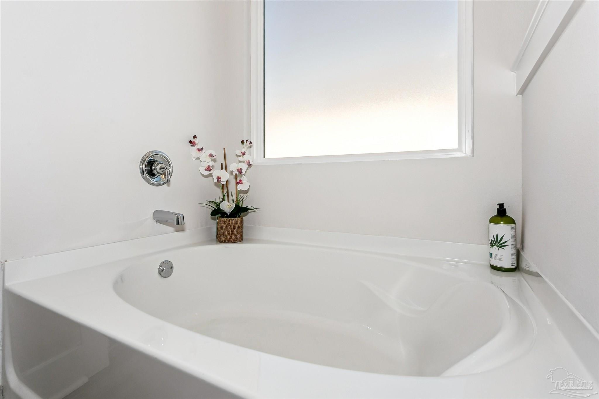 6580 Forest Bay Avenue Gulf Breeze, FL 32563 - Photo 24 of 29 a white bath tub sitting in a bathroom