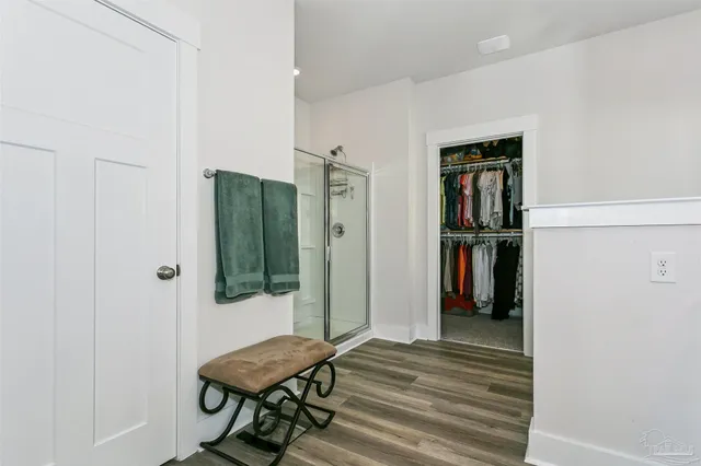 a view of a room that has a bed and a closet in it