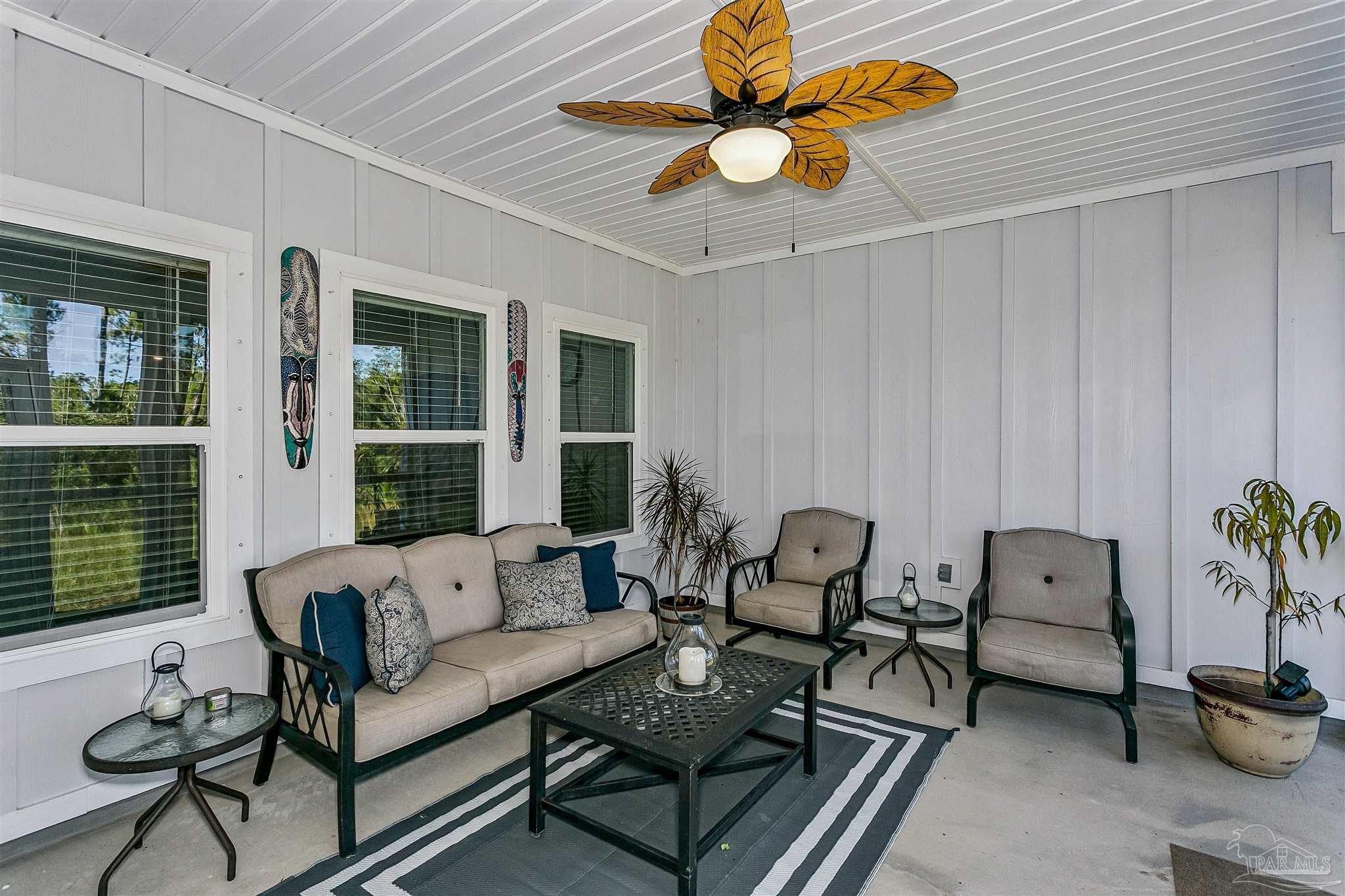 6580 Forest Bay Avenue Gulf Breeze, FL 32563 - Photo 28 of 29 a living room with furniture