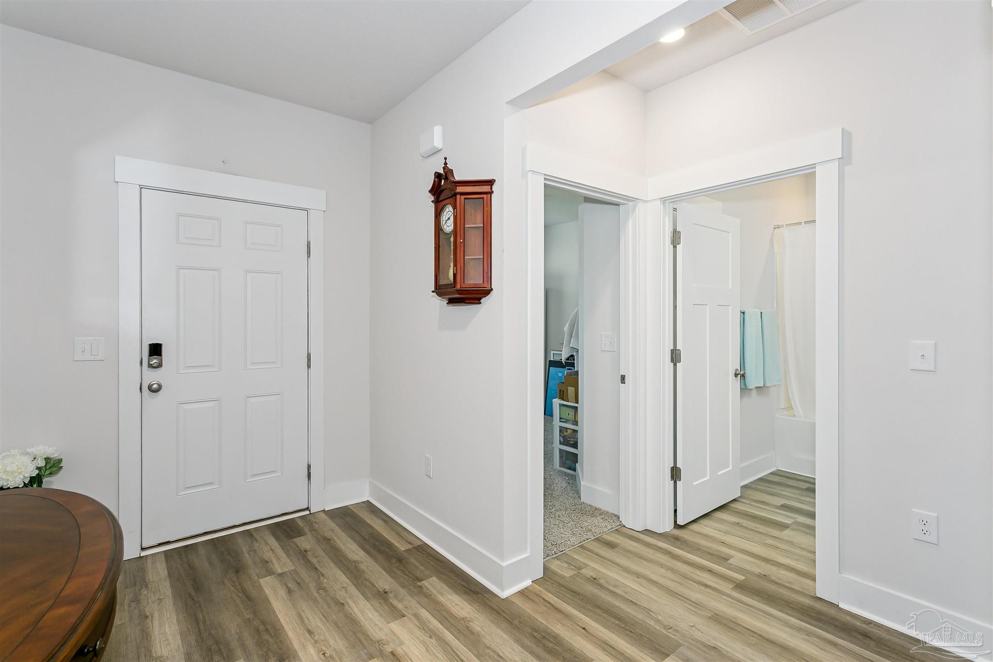 6580 Forest Bay Avenue Gulf Breeze, FL 32563 - Photo 4 of 29 a view of hallway with wooden floor