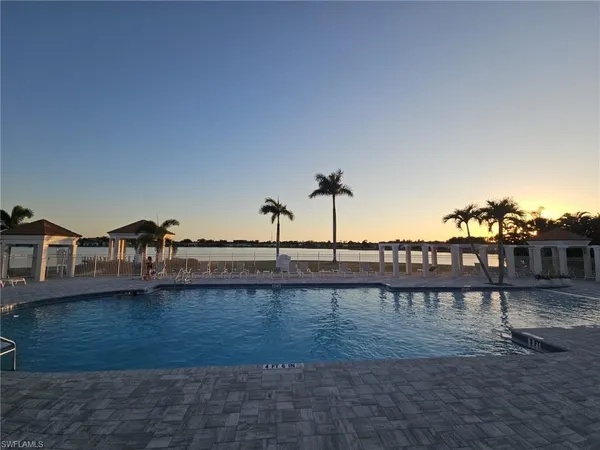 a view of a lake with houses with outdoor space
