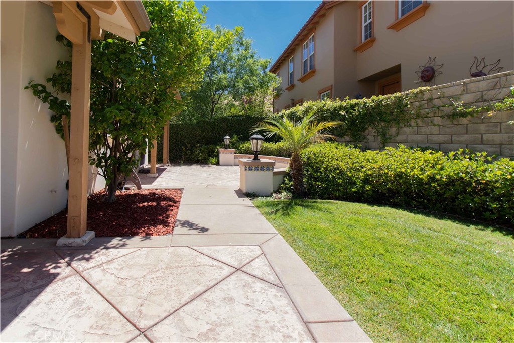 4684 Luna Court Calabasas, CA 91302 - Photo 12 of 48 a view of a backyard with potted plants