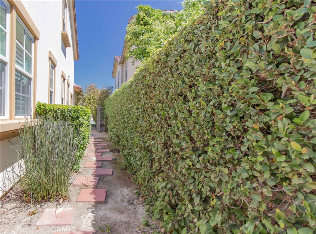4684 Luna Court Calabasas, CA 91302 - Photo 14 of 48 a view of a pathway with plants and brick walls