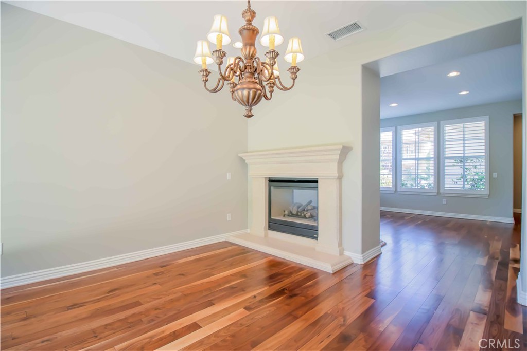 4684 Luna Court Calabasas, CA 91302 - Photo 19 of 48 a view of an empty room with wooden floor and a window
