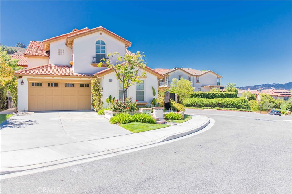 4684 Luna Court Calabasas, CA 91302 - Photo 2 of 48 a front view of a house with a yard and garage