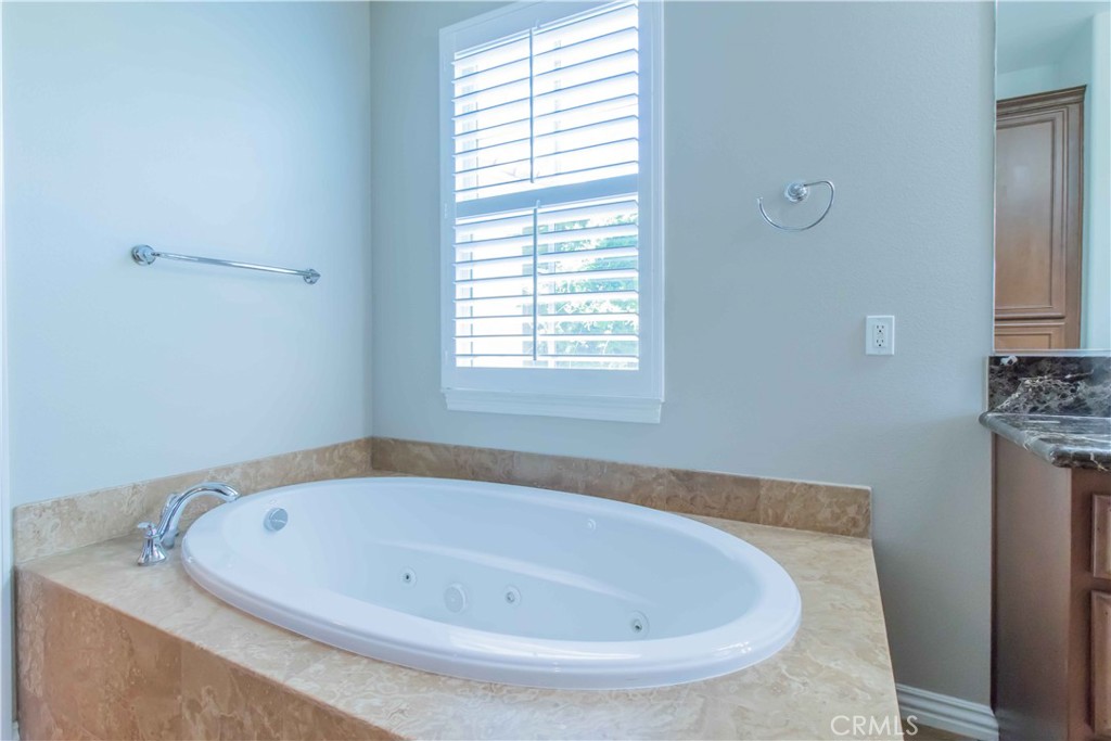 4684 Luna Court Calabasas, CA 91302 - Photo 30 of 48 a white bath tub sitting in a bathroom