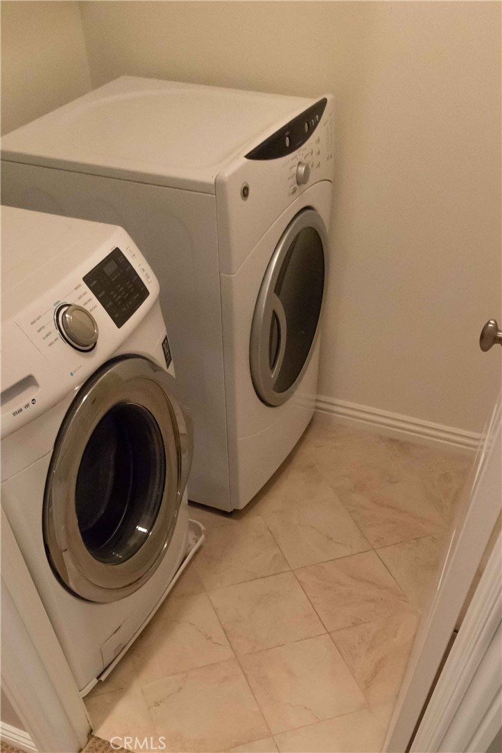 4684 Luna Court Calabasas, CA 91302 - Photo 33 of 48 a utility room with dryer and washer