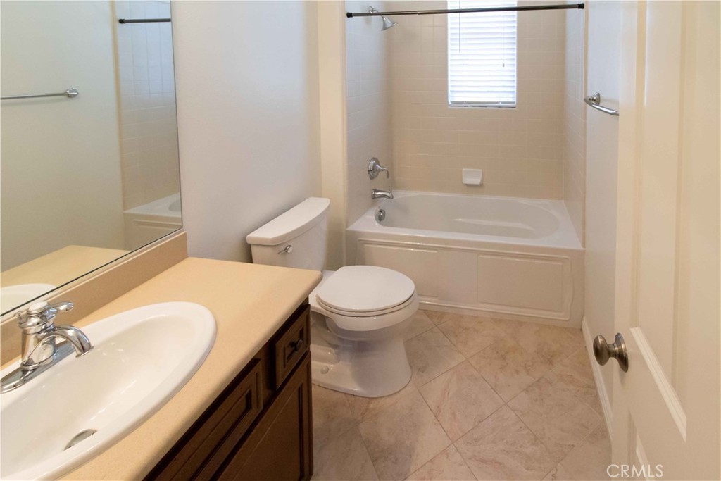 4684 Luna Court Calabasas, CA 91302 - Photo 36 of 48 a bathroom with a granite countertop sink toilet and shower