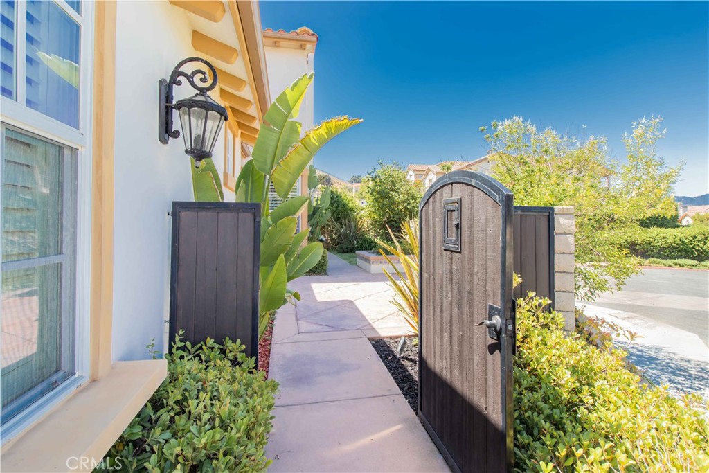 4684 Luna Court Calabasas, CA 91302 - Photo 6 of 48 a front view of a house with a yard and fountain