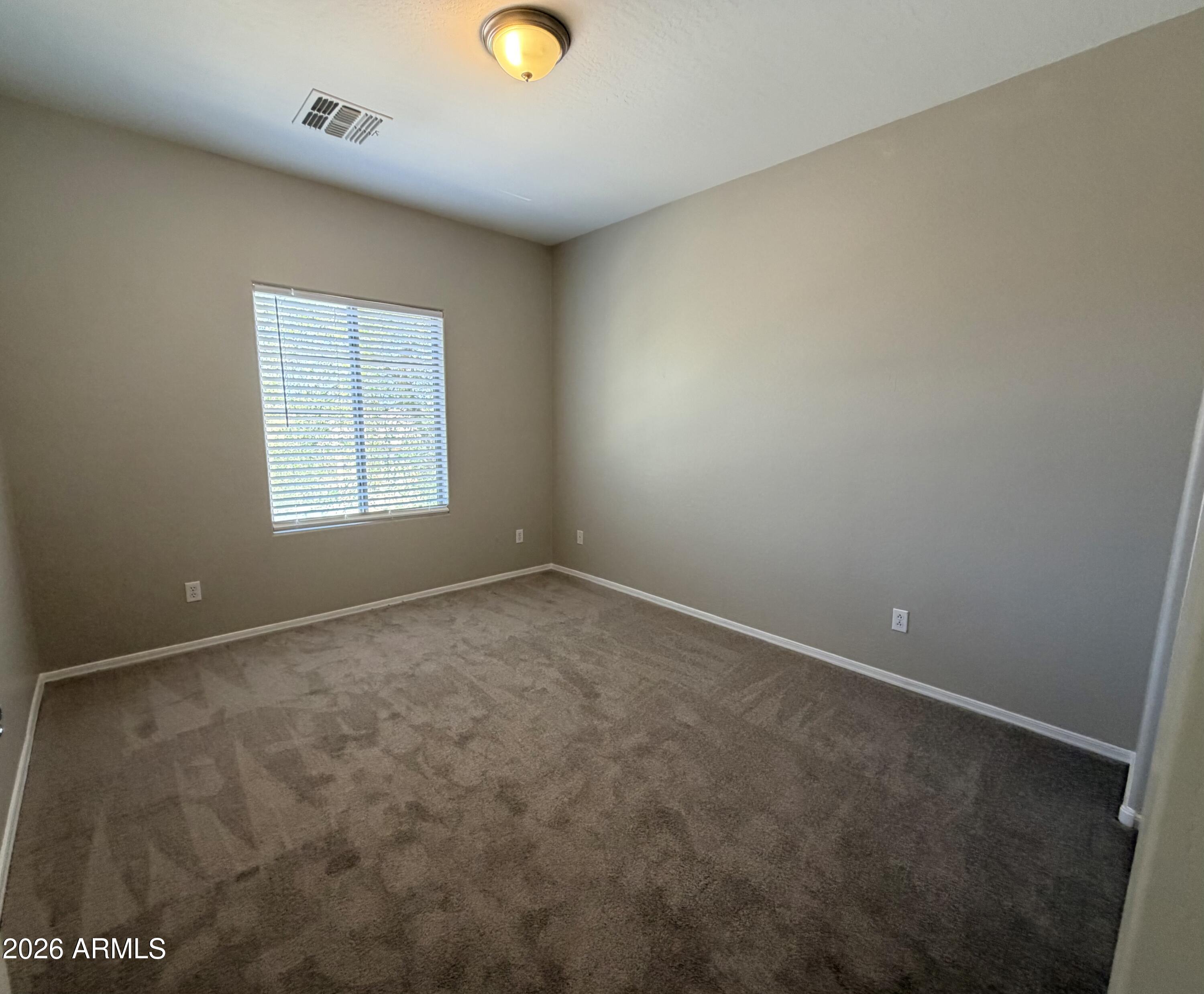 191 West Rio Drive Casa Grande, AZ 85122 - Photo 20 of 34 an empty room with a window