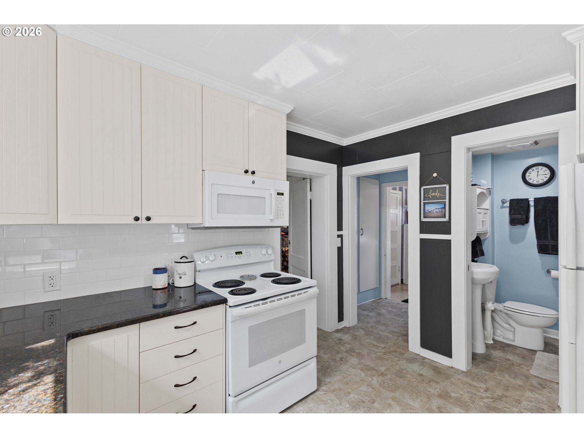 1071 Southwest Church Street Dallas, OR 97338 - Photo 11 of 27 a kitchen with stainless steel appliances a sink a stove a refrigerator and cabinets