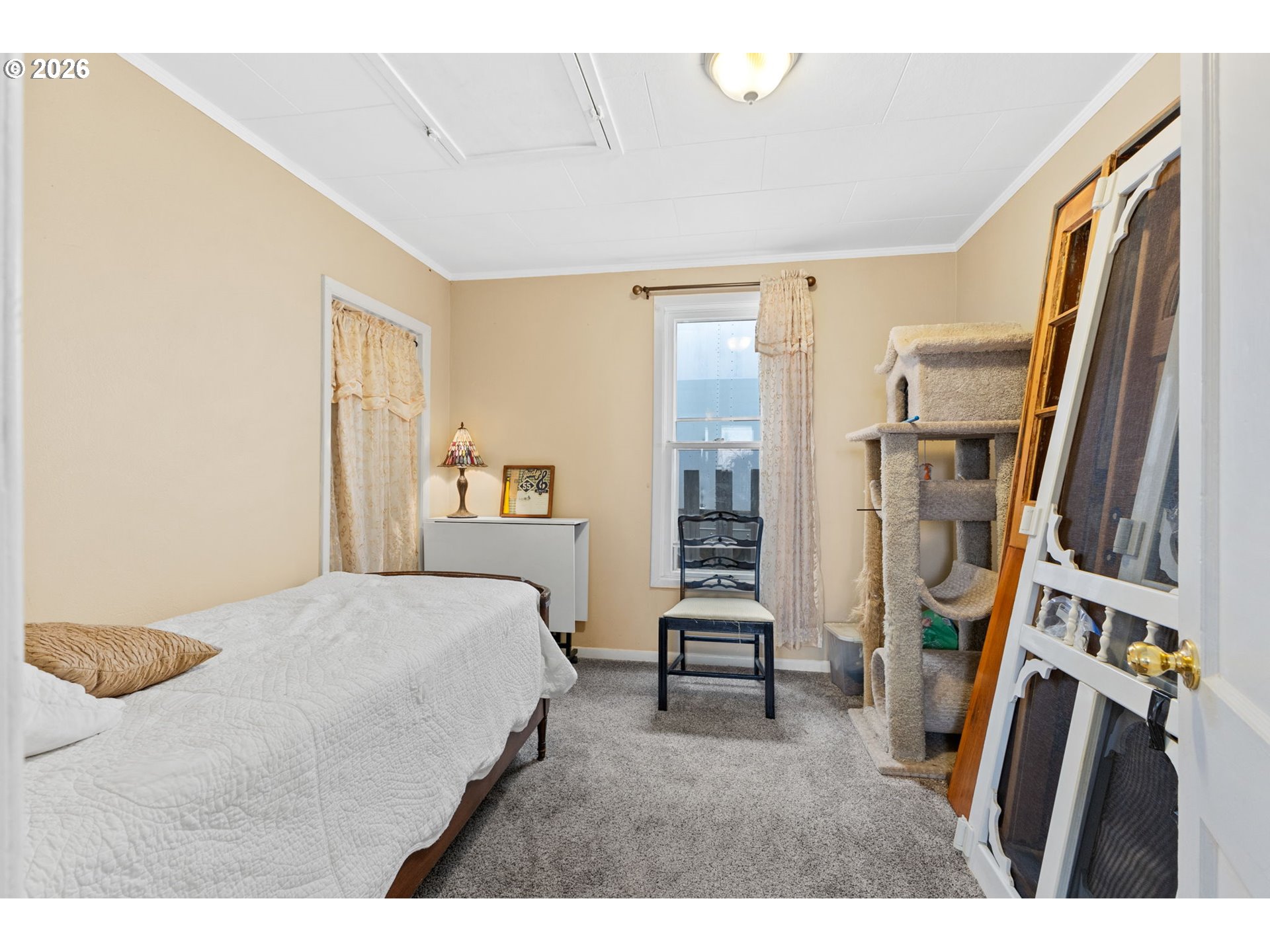 1071 Southwest Church Street Dallas, OR 97338 - Photo 16 of 27 a bedroom with a bed window and a flat screen tv