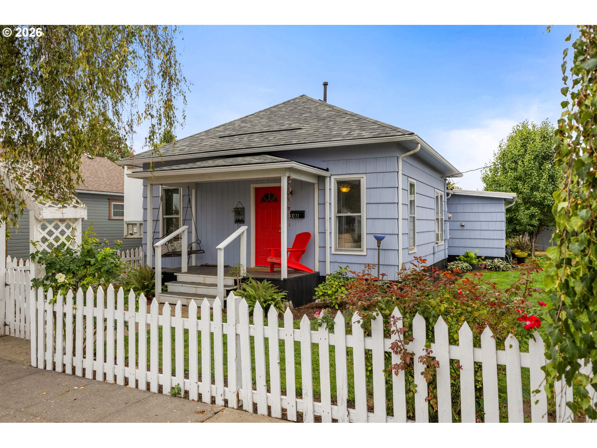1071 Southwest Church Street Dallas, OR 97338 - Photo 2 of 27 a front view of a house with wooden fence