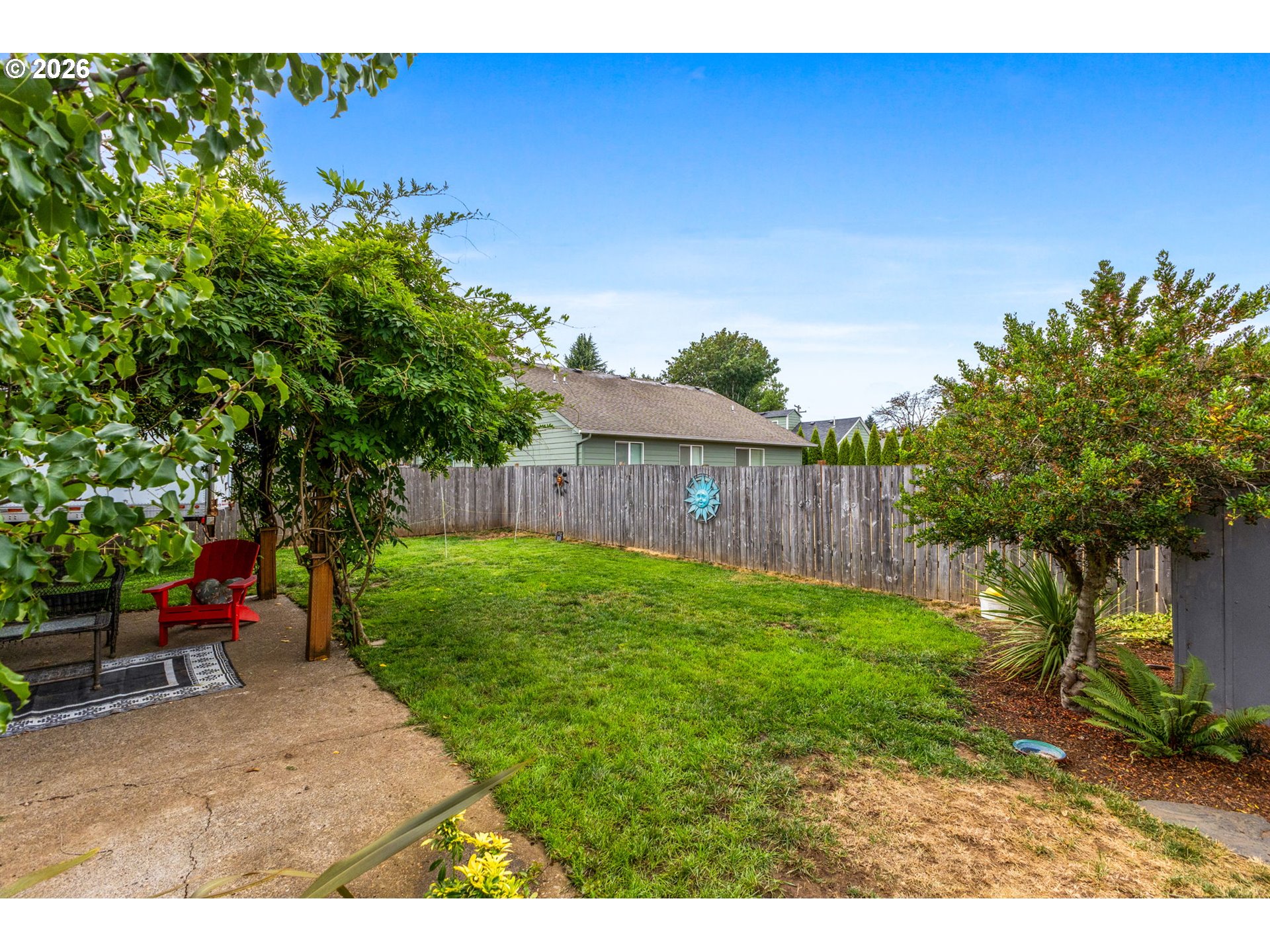 1071 Southwest Church Street Dallas, OR 97338 - Photo 21 of 27 a backyard of a house with lots of green space