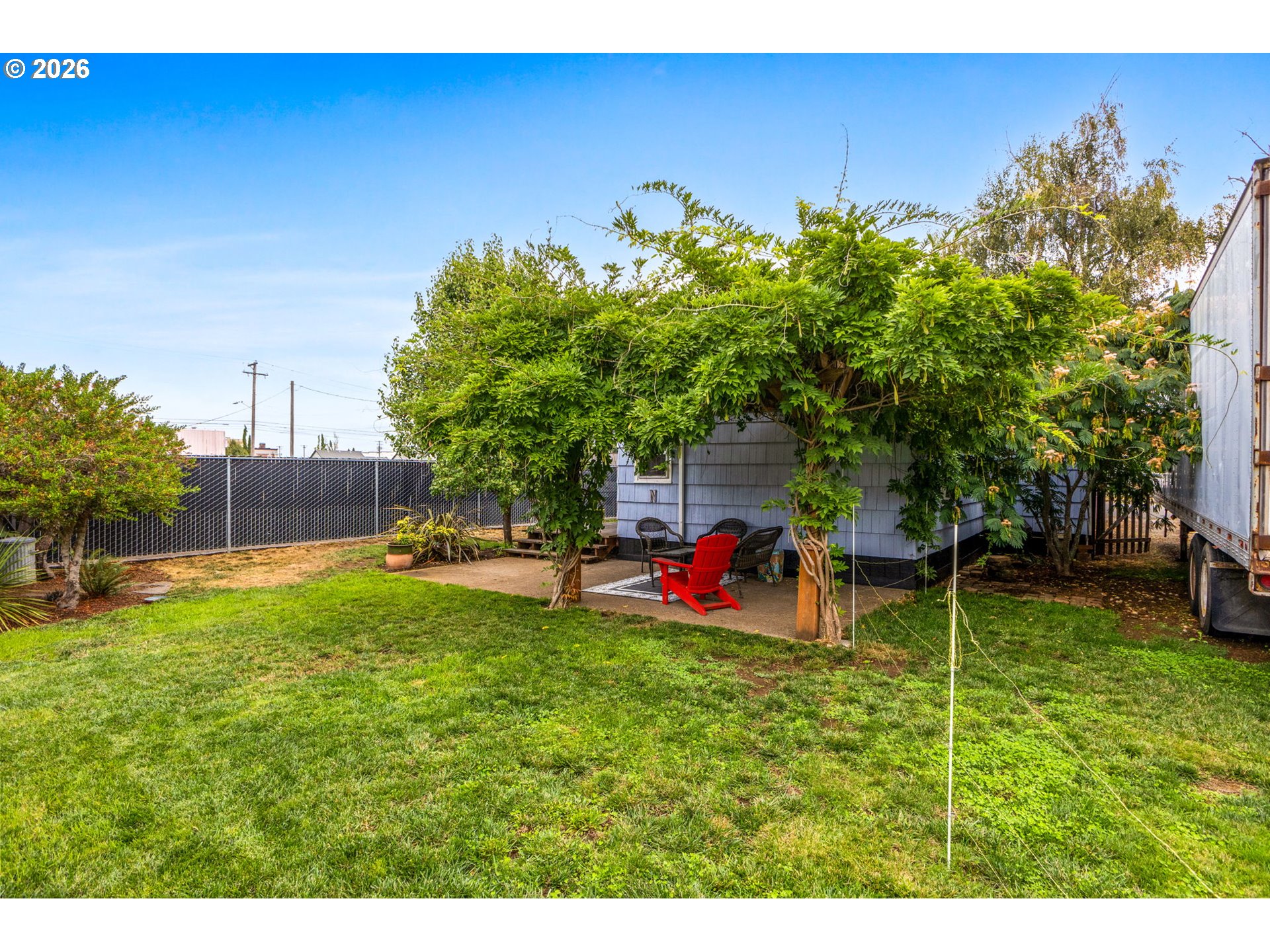 1071 Southwest Church Street Dallas, OR 97338 - Photo 24 of 27 a view of a backyard with plants and a bench