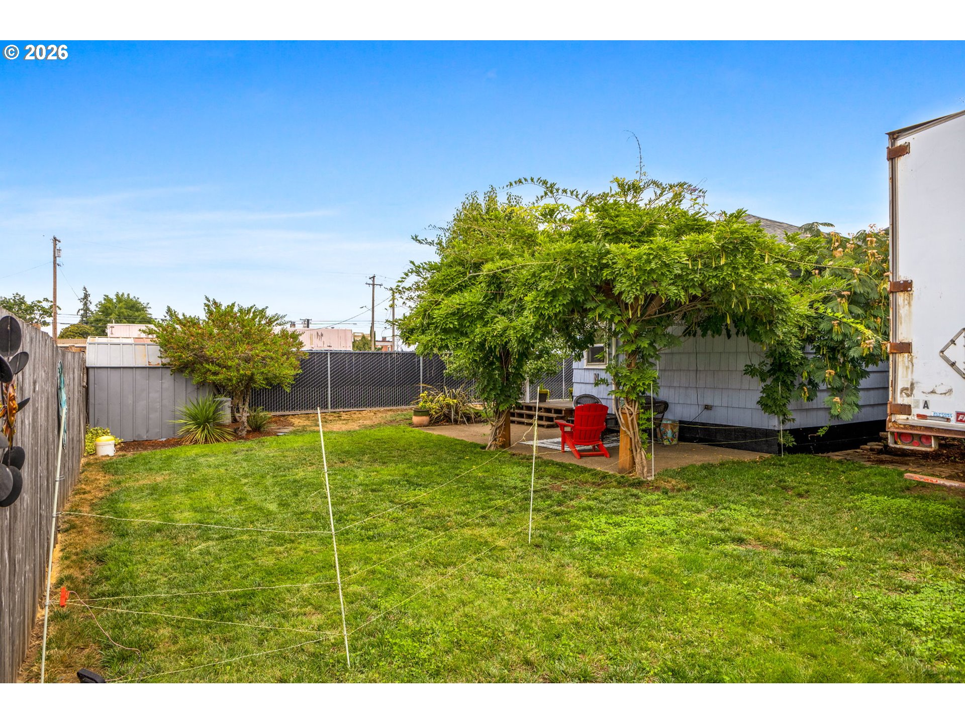 1071 Southwest Church Street Dallas, OR 97338 - Photo 25 of 27 a backyard of a house with table and chairs