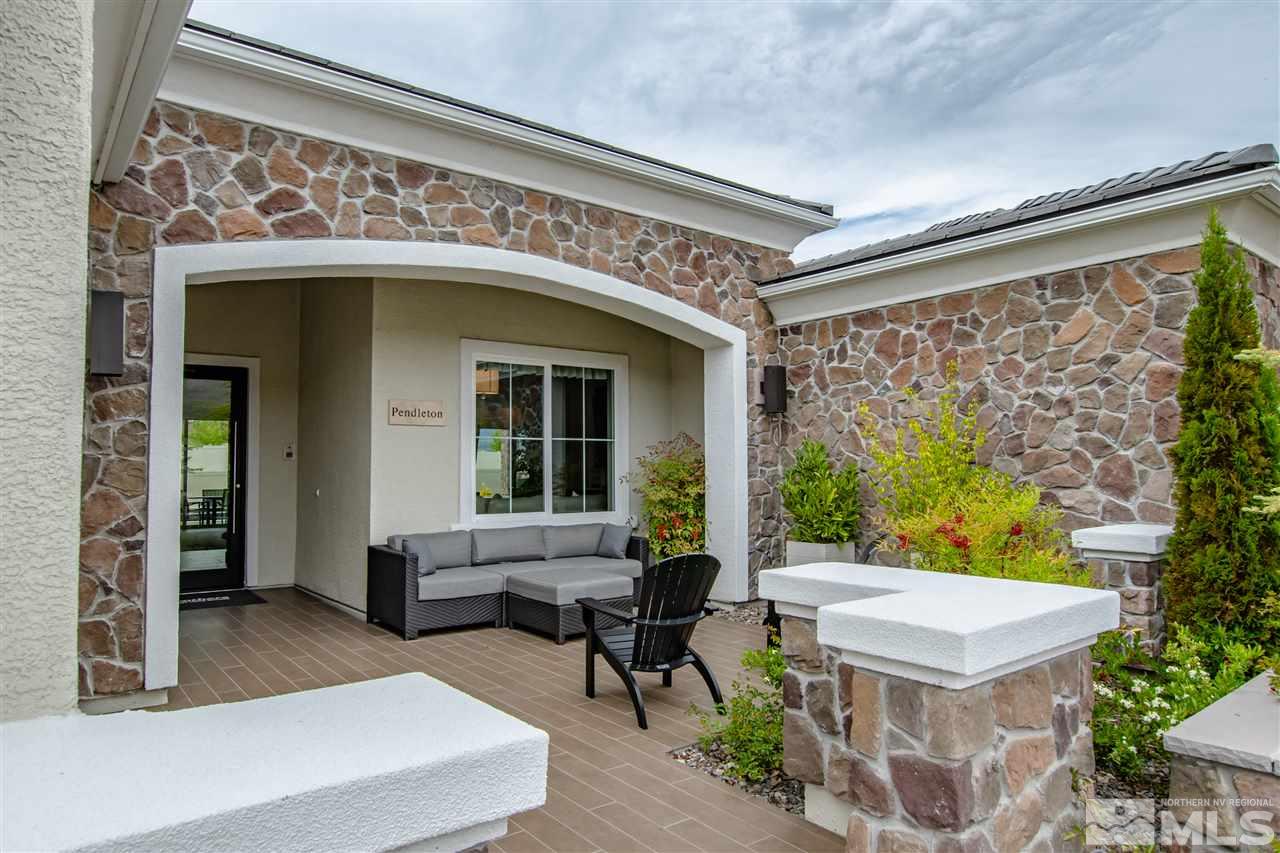 2670 Hanovarian Way, Unit PENDLETON MODEL SALE Reno, NV 89521 - Photo 3 of 25 a view of a patio with couches table and chairs and potted plants