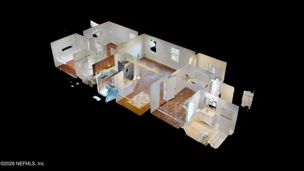 an aerial view of a house with outdoor space and parking