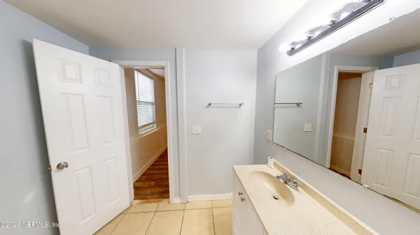 a bathroom with a sink and a shower