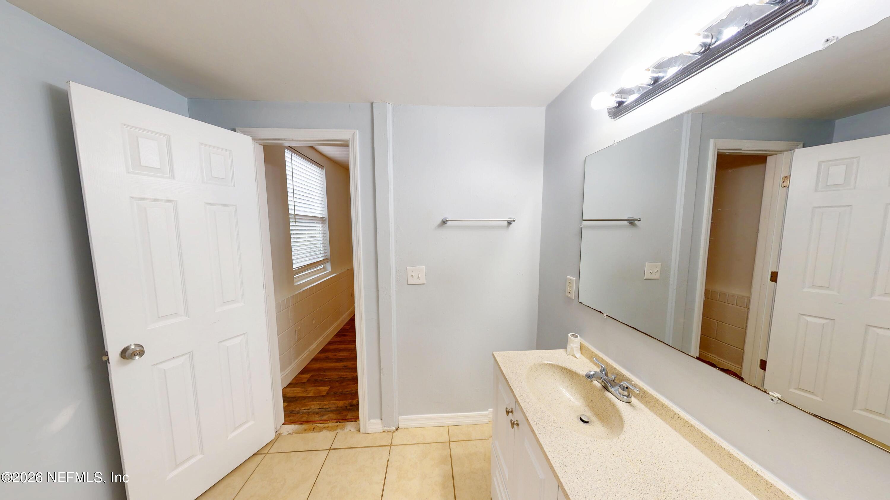 6926 Camelot Road Jacksonville, FL 32211 - Photo 10 of 16 a bathroom with a sink and a shower