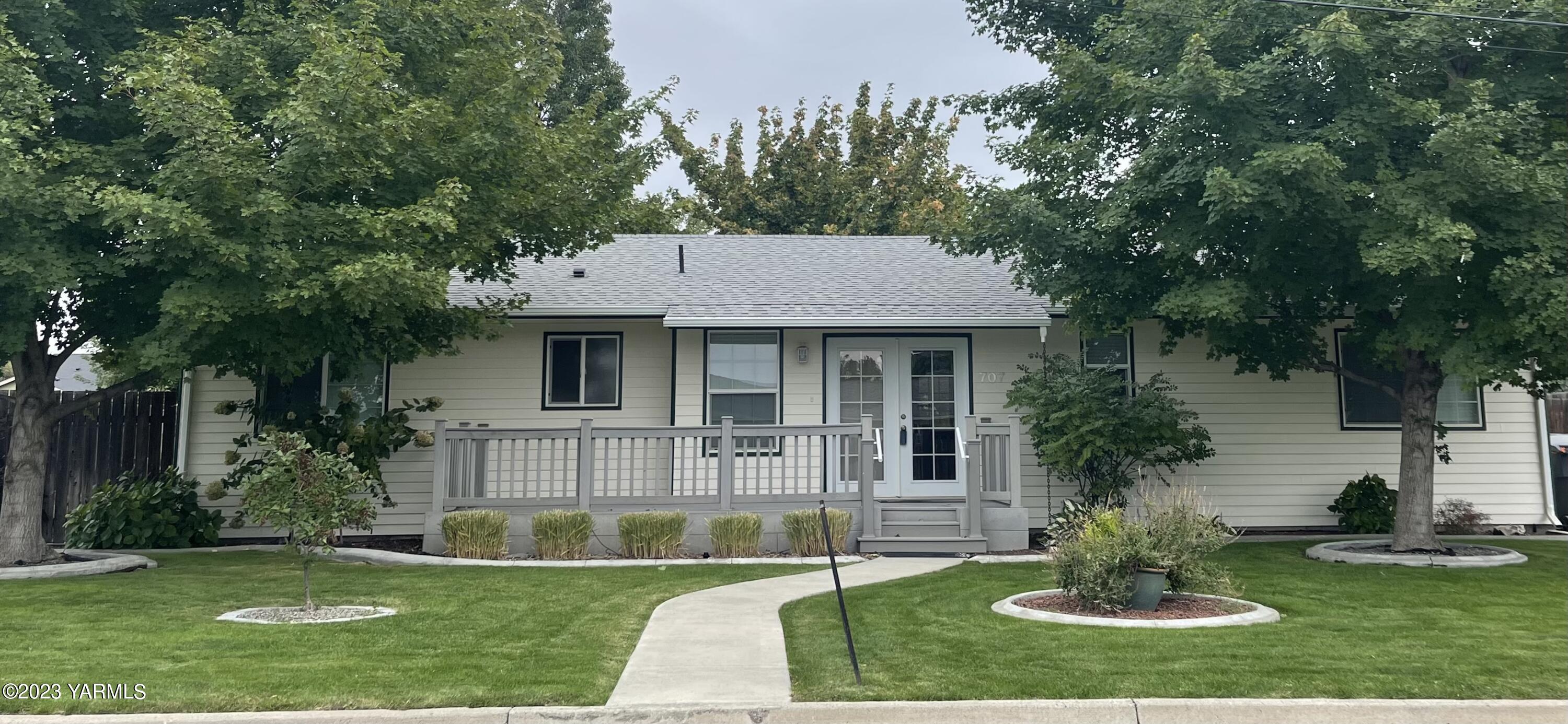 a view of a house with a yard porch and sitting area