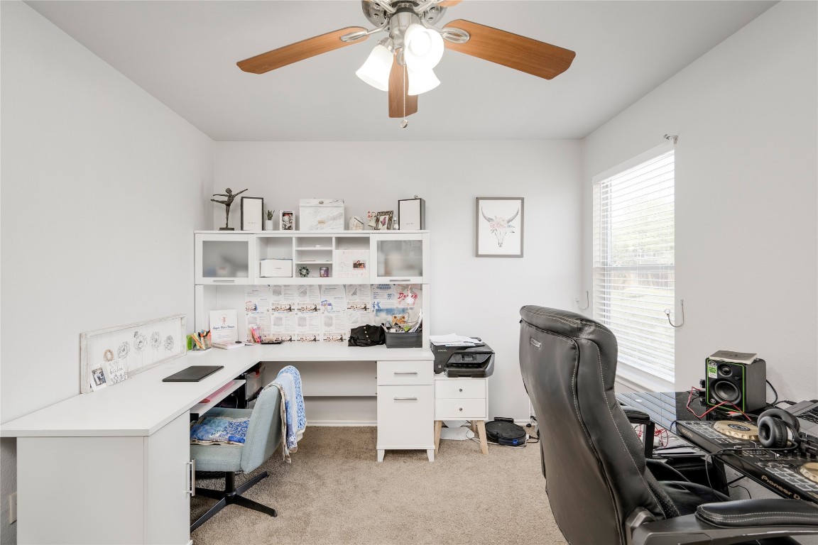 148 Buttercup Way Kyle, TX 78640 - Photo 25 of 40 a view of a workspace with furniture and a window