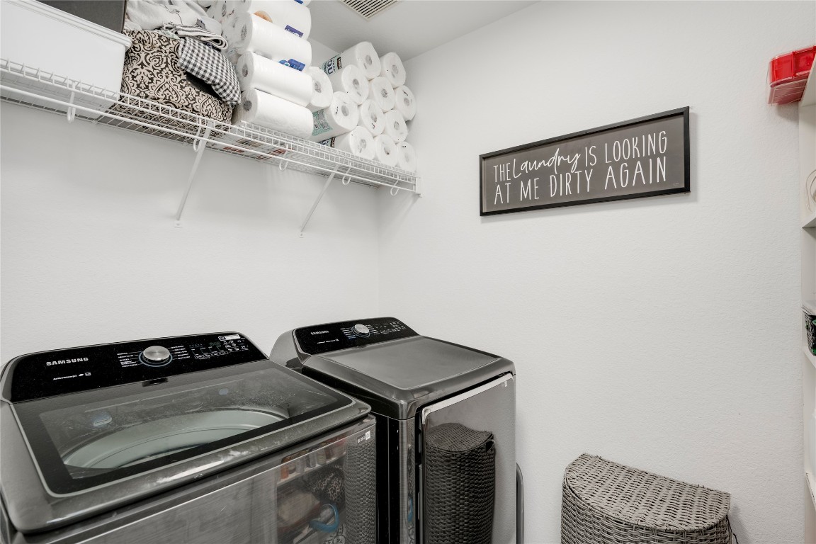 148 Buttercup Way Kyle, TX 78640 - Photo 27 of 40 a close view of a utility room with washer and dryer