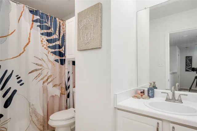 a view of a house with backyard and porch