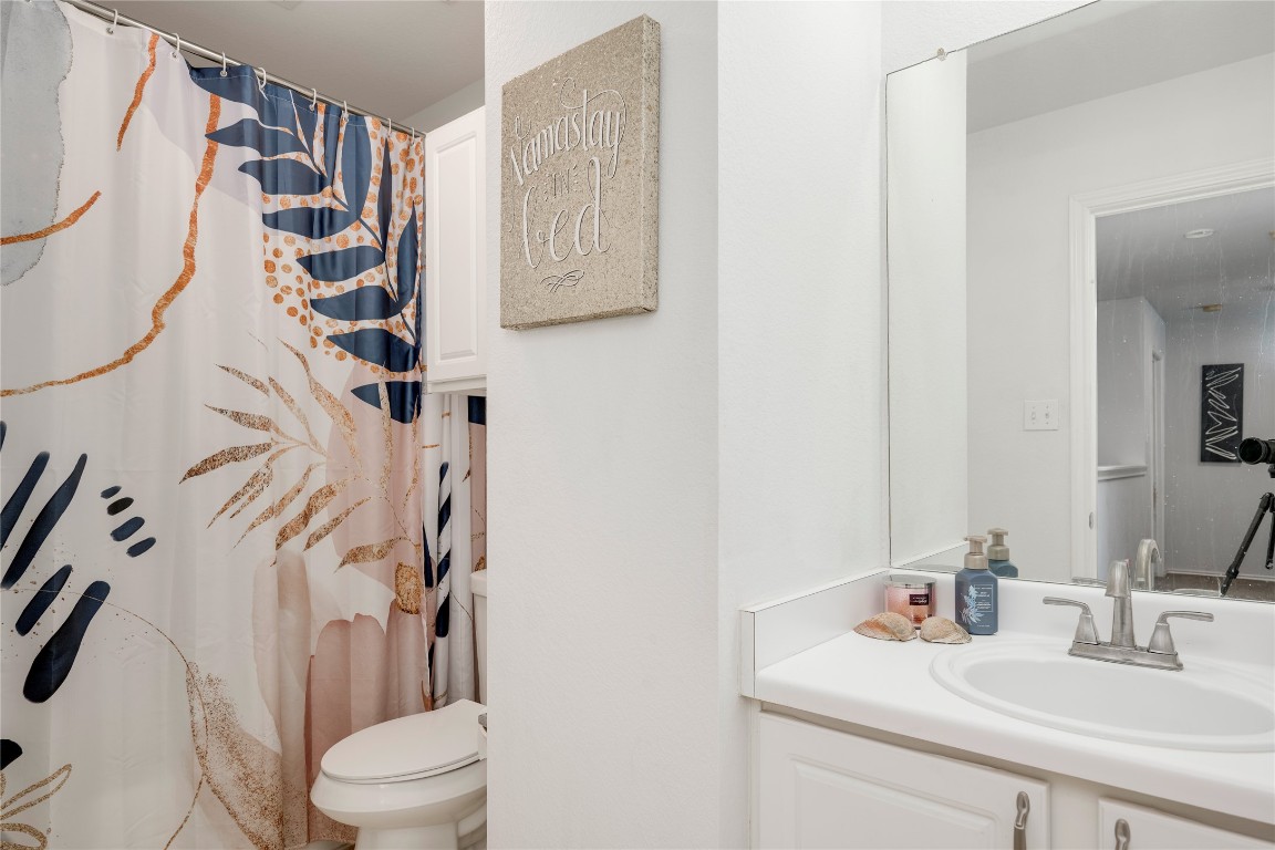 148 Buttercup Way Kyle, TX 78640 - Photo 31 of 40 a bathroom with a sink toilet and shower
