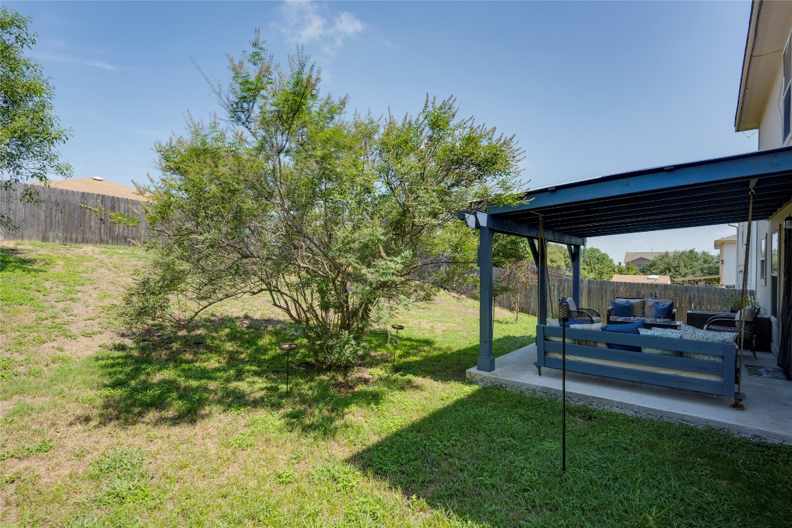 148 Buttercup Way Kyle, TX 78640 - Photo 37 of 40 a backyard of a house with table and chairs