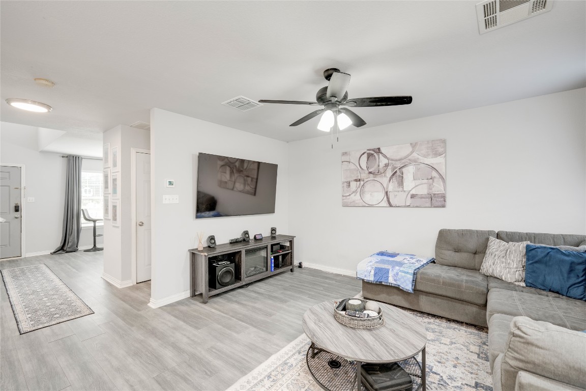 148 Buttercup Way Kyle, TX 78640 - Photo 9 of 40 a living room with furniture and a flat screen tv