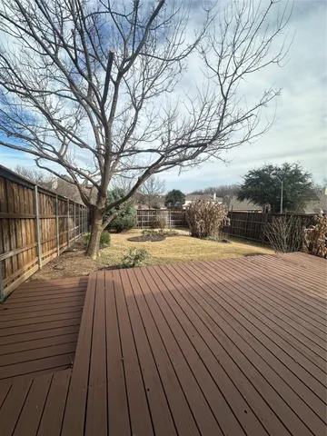 a view of outdoor space with wooden floor