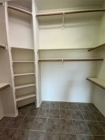a view of an empty walk in closet