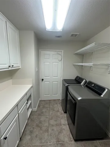 a kitchen that has a sink and a stove