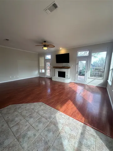 a view of livingroom with furniture flat screen tv and window