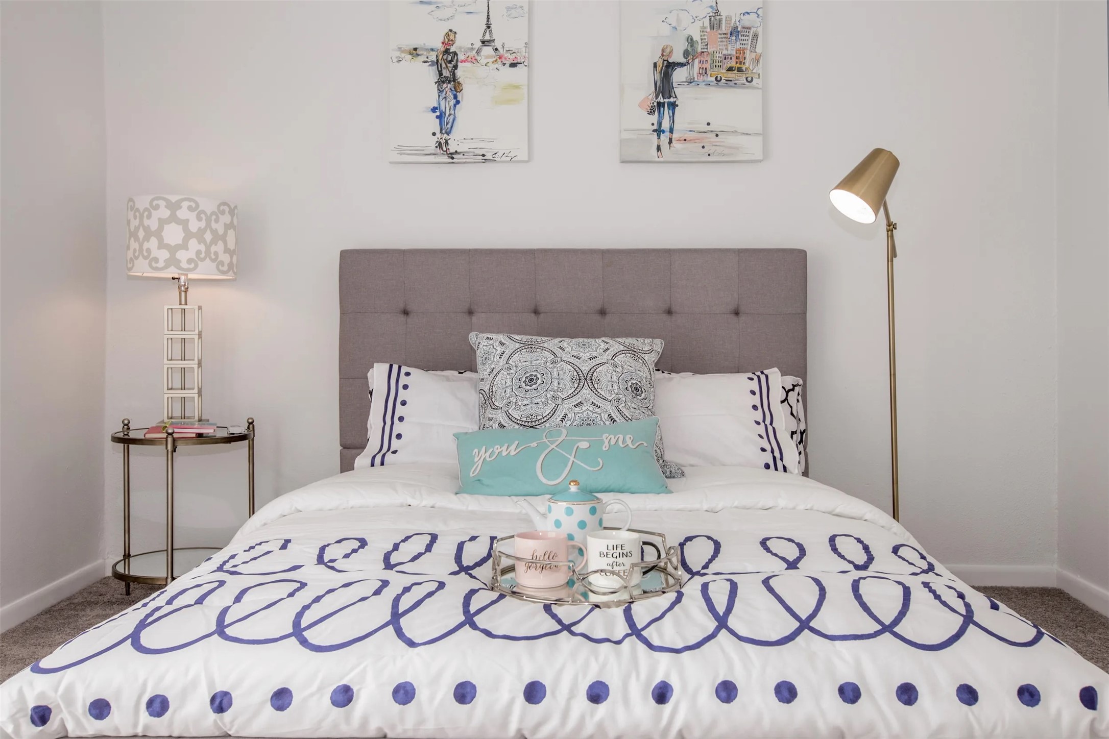 2101 Hayes Road, Unit 606 Houston, TX 77042 - Photo 2 of 17 a bedroom with a large bed and a lamp