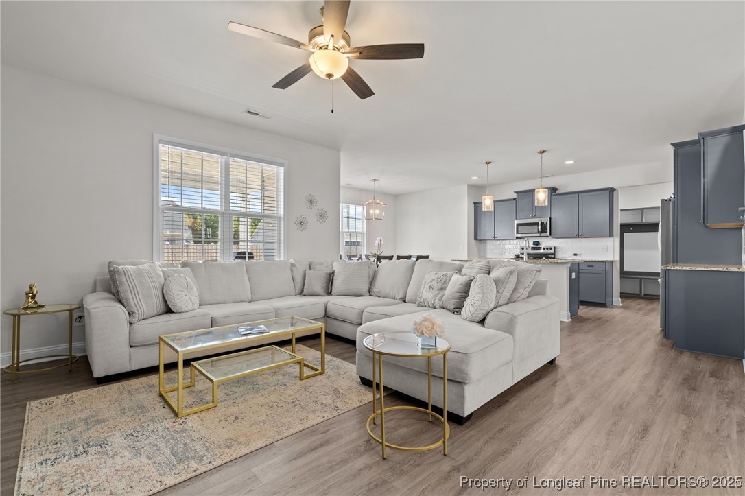 212 Winnsboro Road Raeford, NC 28376 - Photo 13 of 50 a living room with furniture and kitchen view