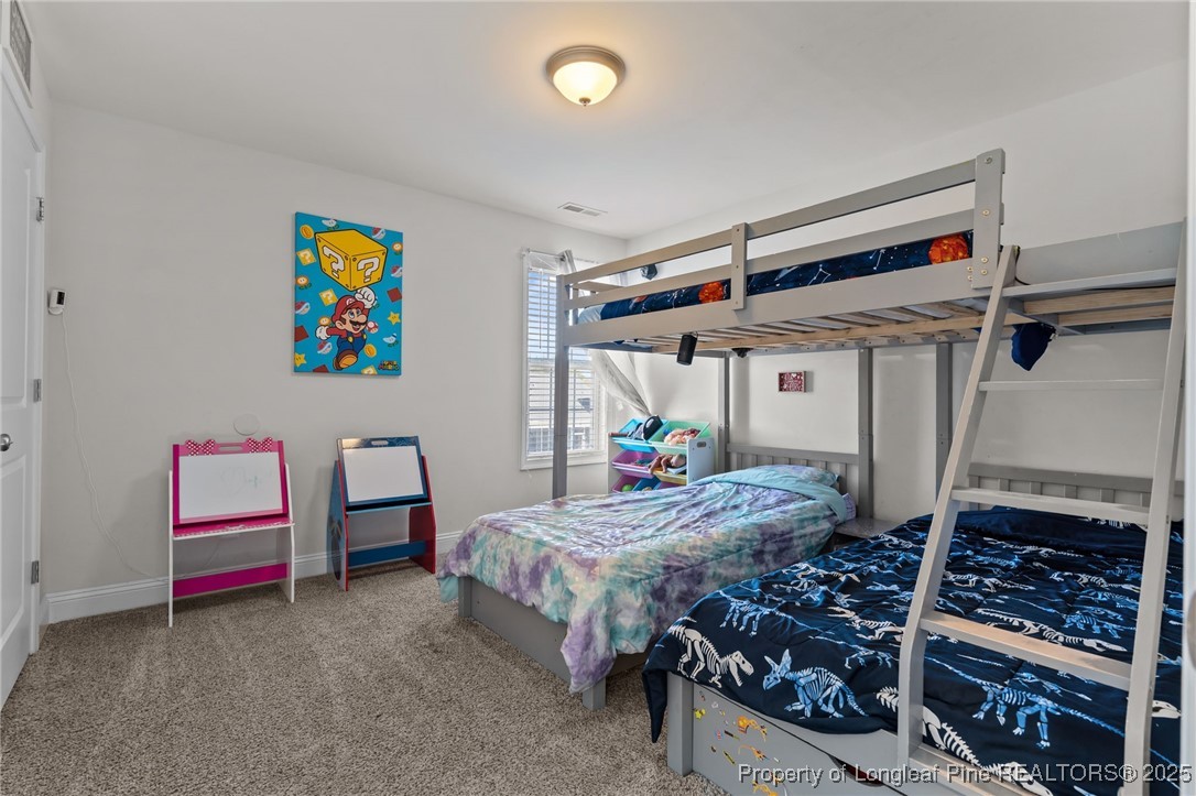 212 Winnsboro Road Raeford, NC 28376 - Photo 30 of 50 a bed room with furniture and a window