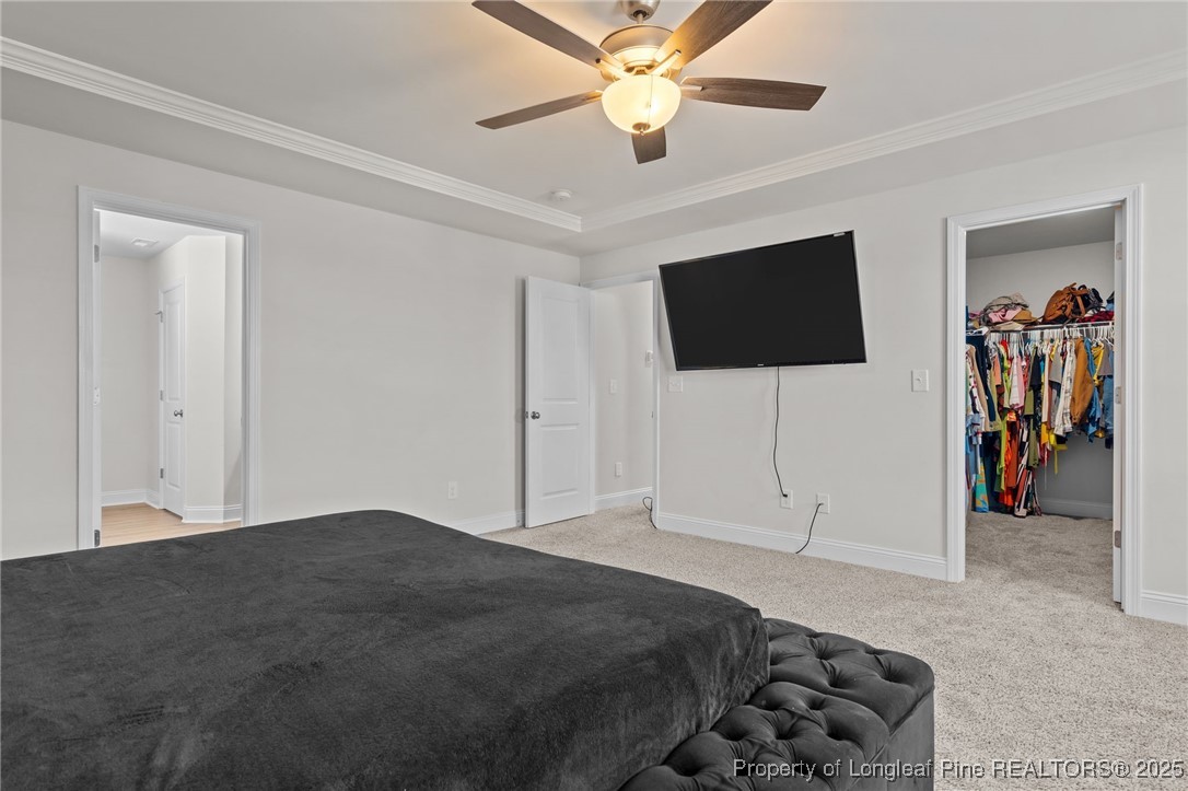 212 Winnsboro Road Raeford, NC 28376 - Photo 38 of 50 a bedroom with a bed and a flat screen tv