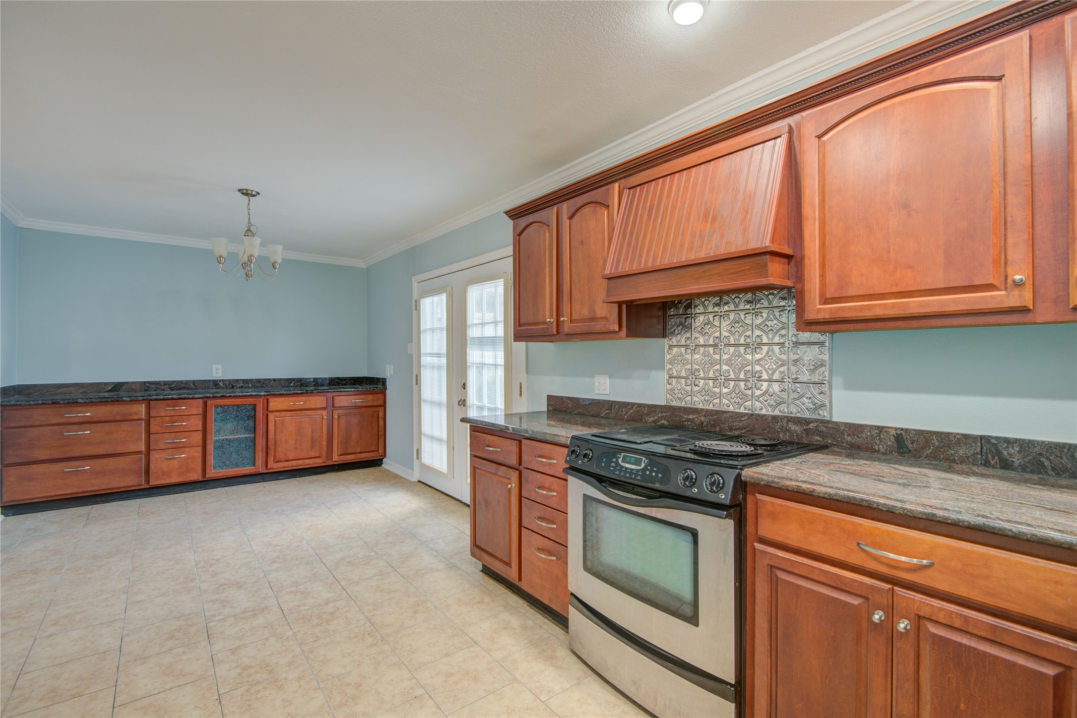 1424 Silverpines Road, Unit 1424 Houston, TX 77062 - Photo 14 of 33 a kitchen with stainless steel appliances granite countertop a stove a sink and a microwave