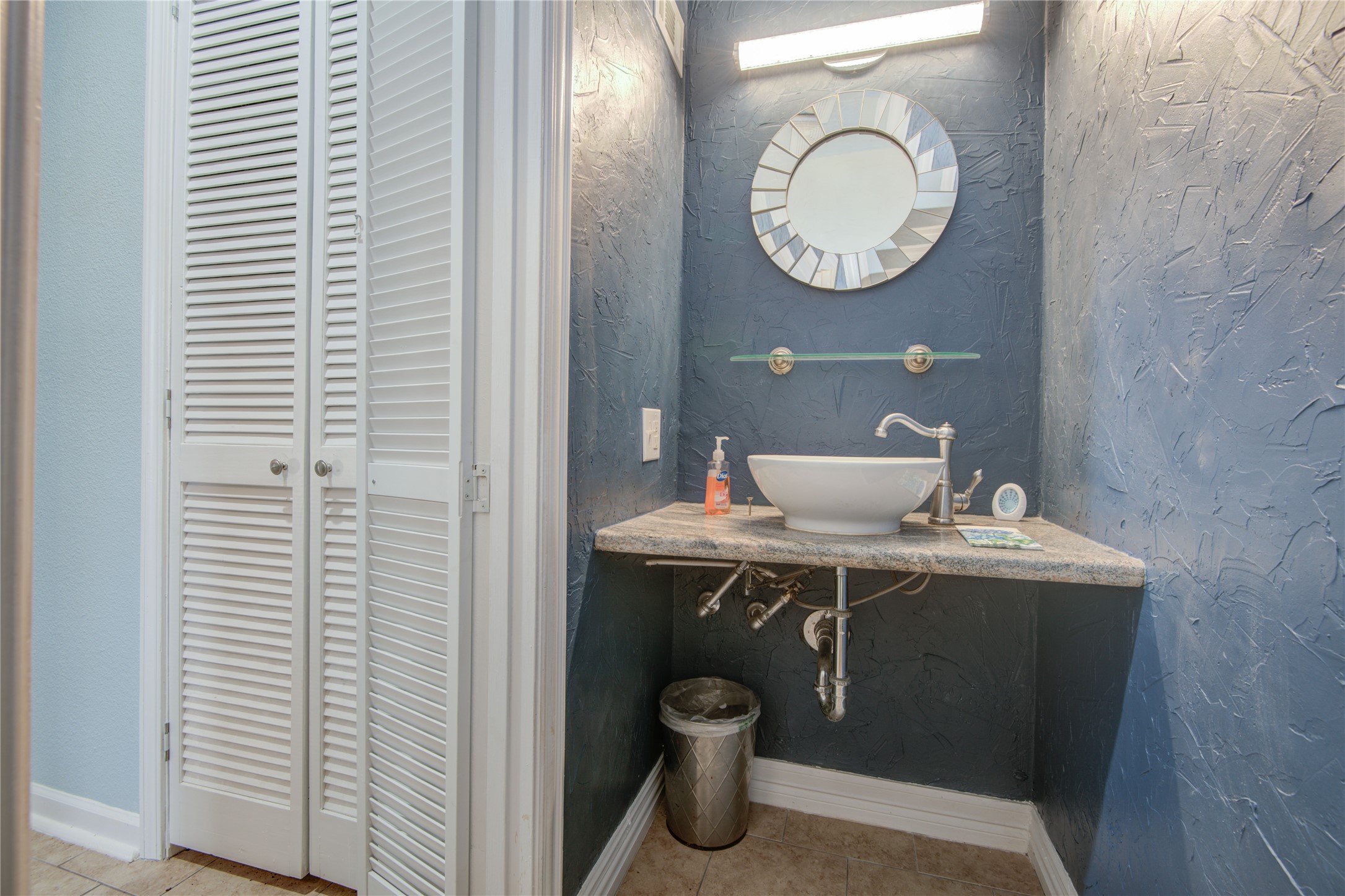 1424 Silverpines Road, Unit 1424 Houston, TX 77062 - Photo 17 of 33 a bathroom with a toilet a sink and a mirror