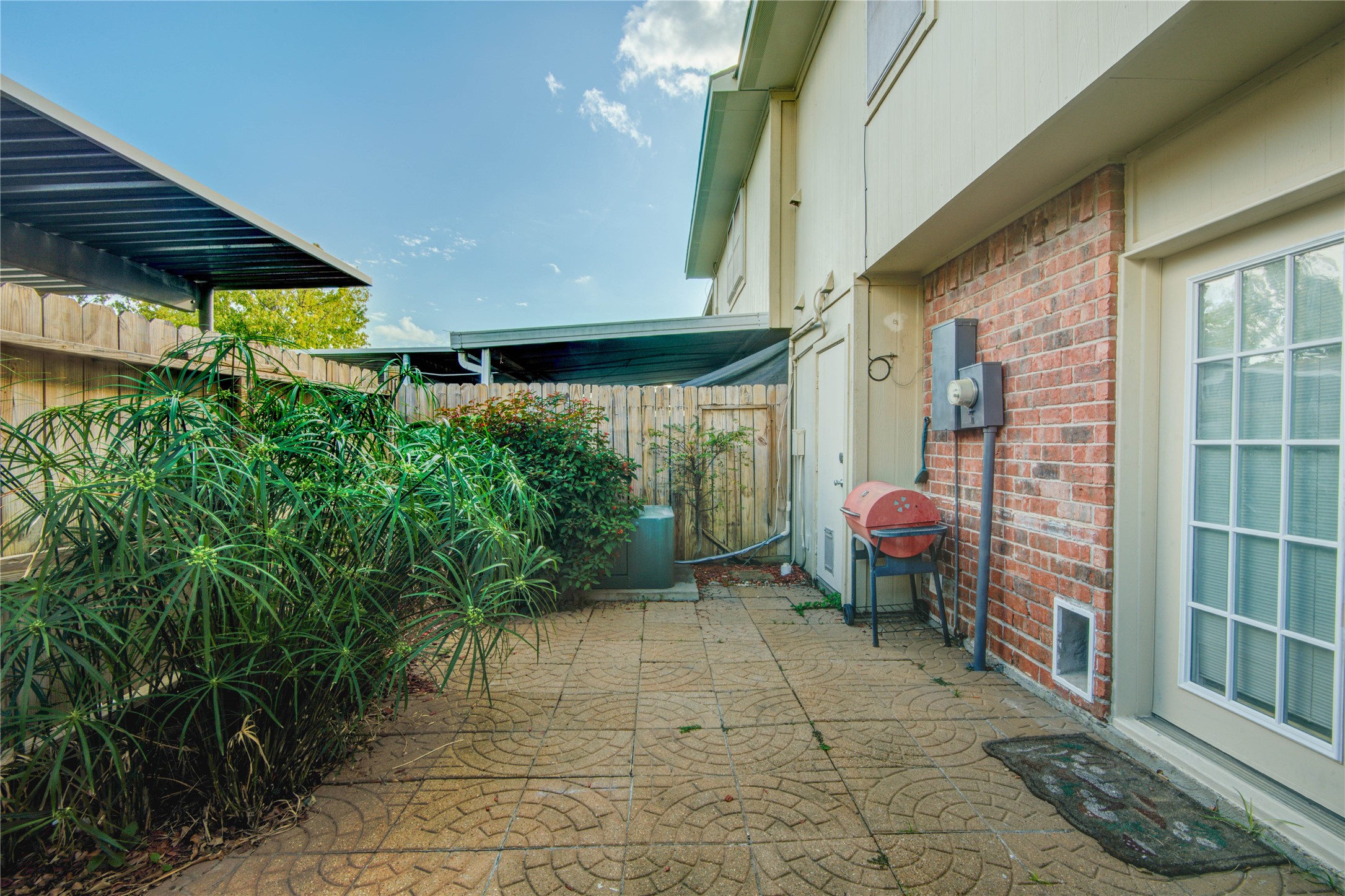 1424 Silverpines Road, Unit 1424 Houston, TX 77062 - Photo 32 of 33 a view of a chairs and table in the patio