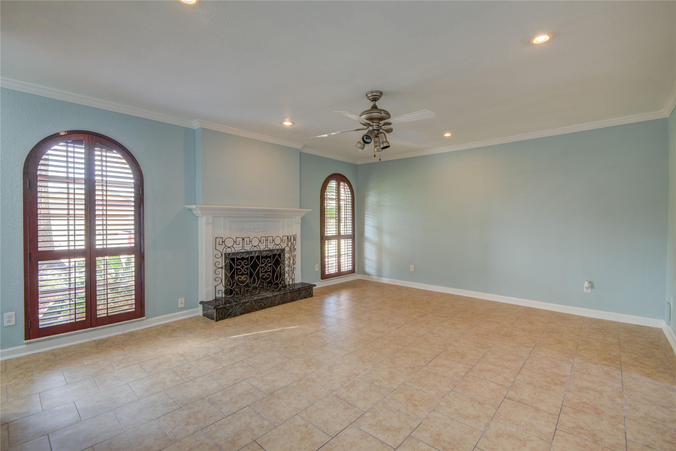 1424 Silverpines Road, Unit 1424 Houston, TX 77062 - Photo 7 of 33 a view of an empty room with a fireplace and a window