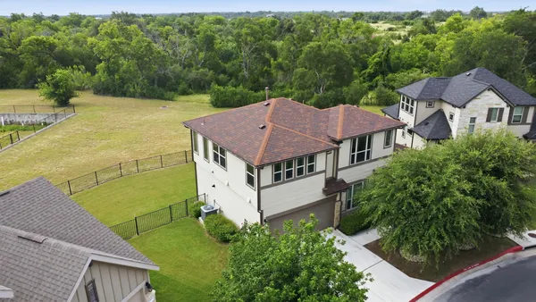 an aerial view of a house with a garden