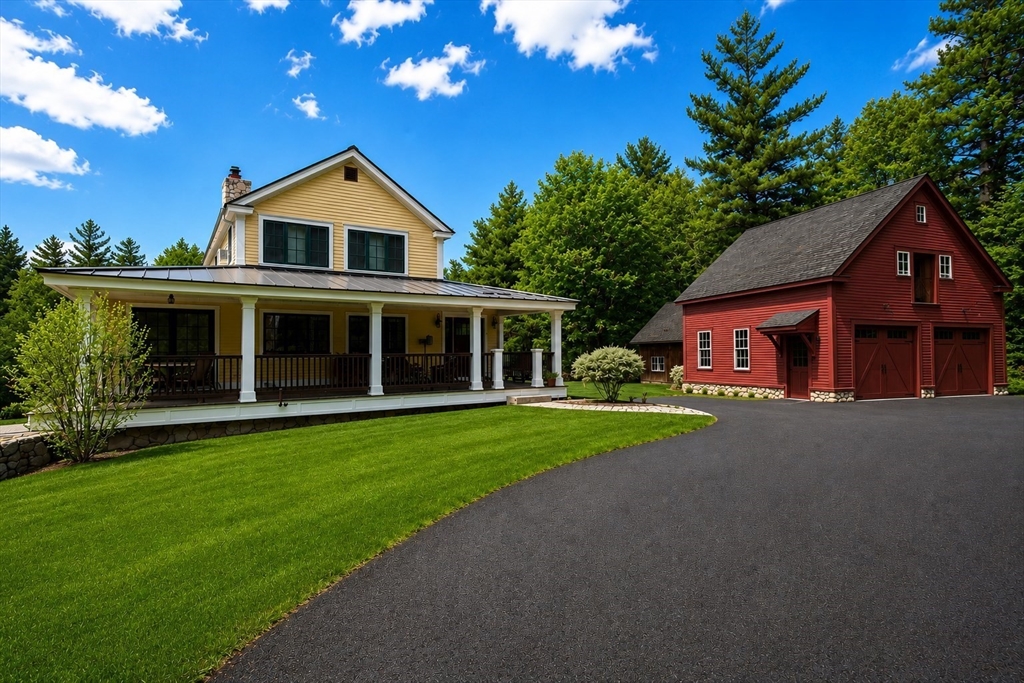 360 Teel Road Winchendon, MA 01475 - Photo 3 of 42 a front view of a house with a yard and garage